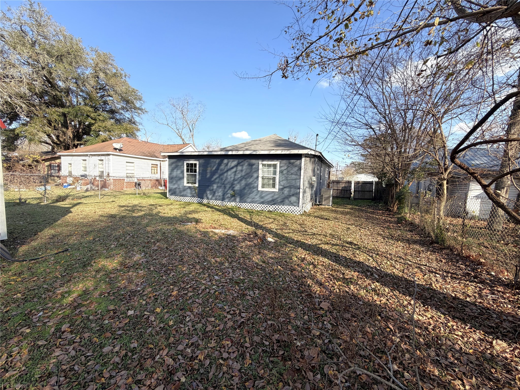 410 North Elm Street Trinity, TX 75862 - Photo 3 of 20 a view of a house with a yard covered in snow
