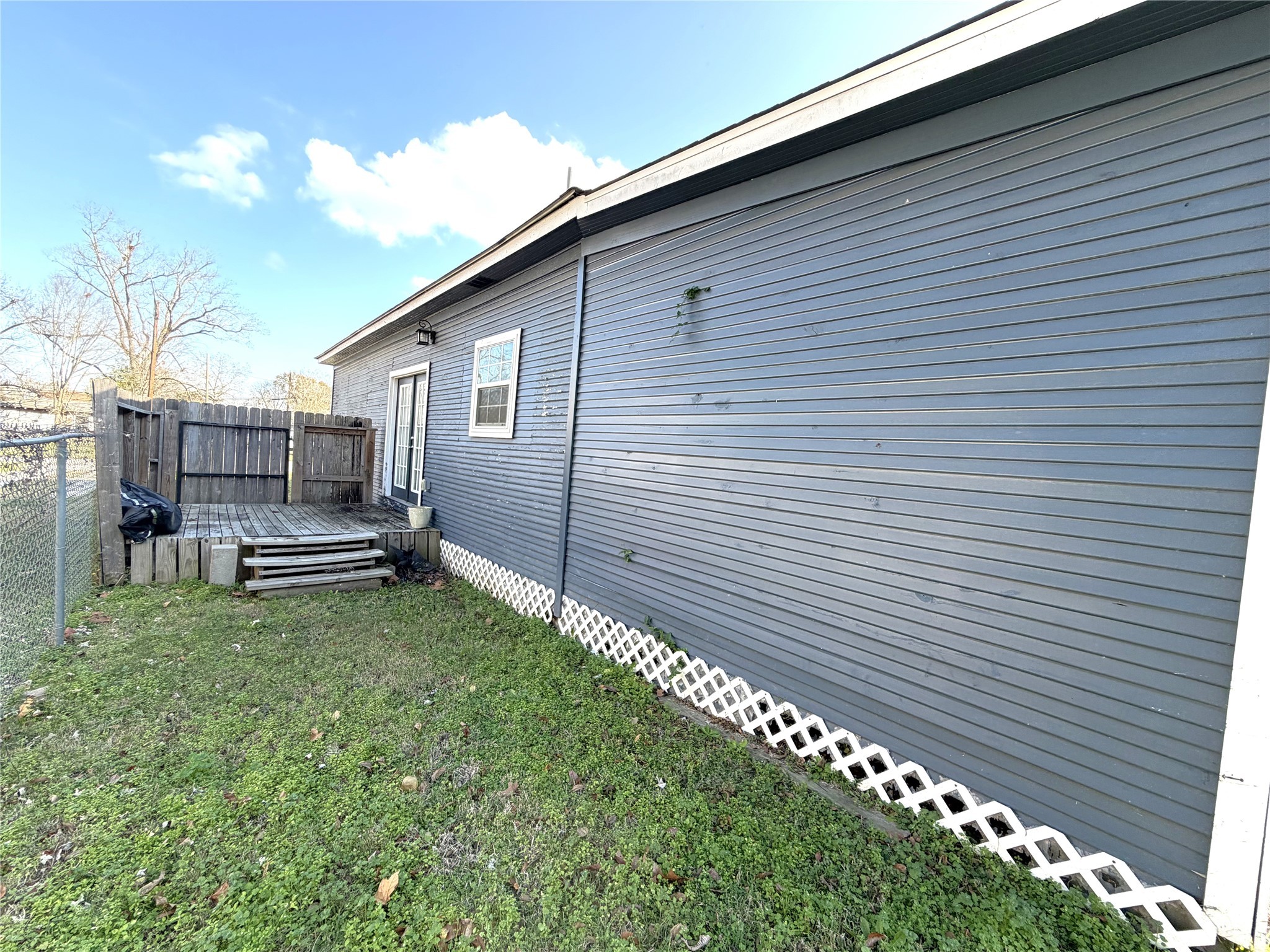 410 North Elm Street Trinity, TX 75862 - Photo 5 of 20 a house view with a backyard space