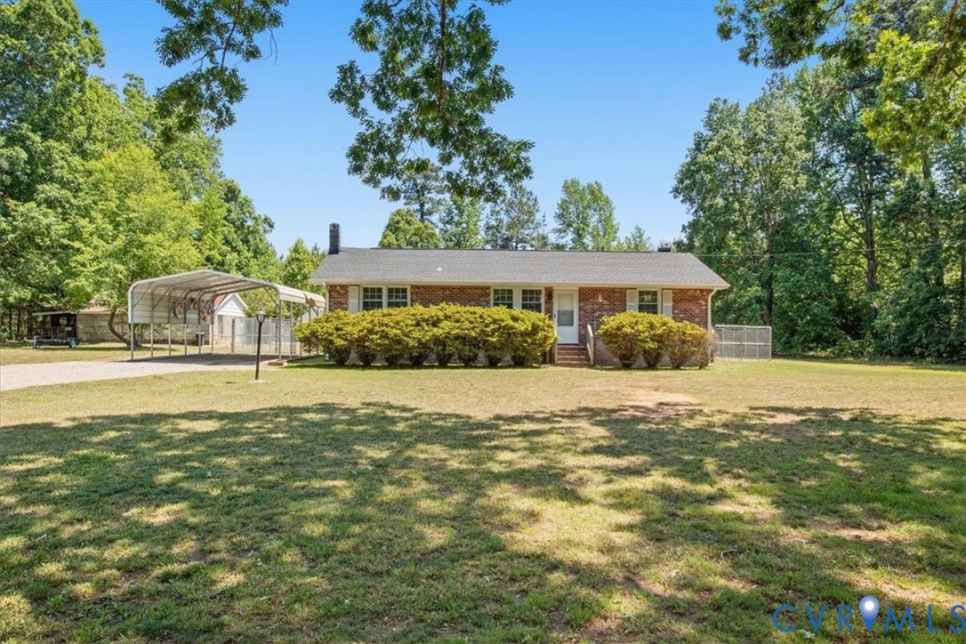 15503 Eppes Road Dewitt, VA 23840 - Photo 22 of 22 a front view of a house with a yard and swimming pool