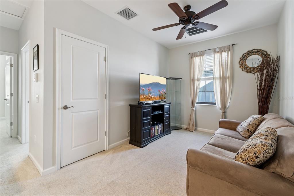 5714 Colony Glen Road Lithia, FL 33547 - Photo 17 of 66 a living room with furniture and a flat screen tv