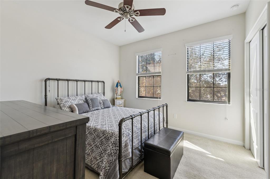 5714 Colony Glen Road Lithia, FL 33547 - Photo 18 of 66 a bedroom with furniture and windows