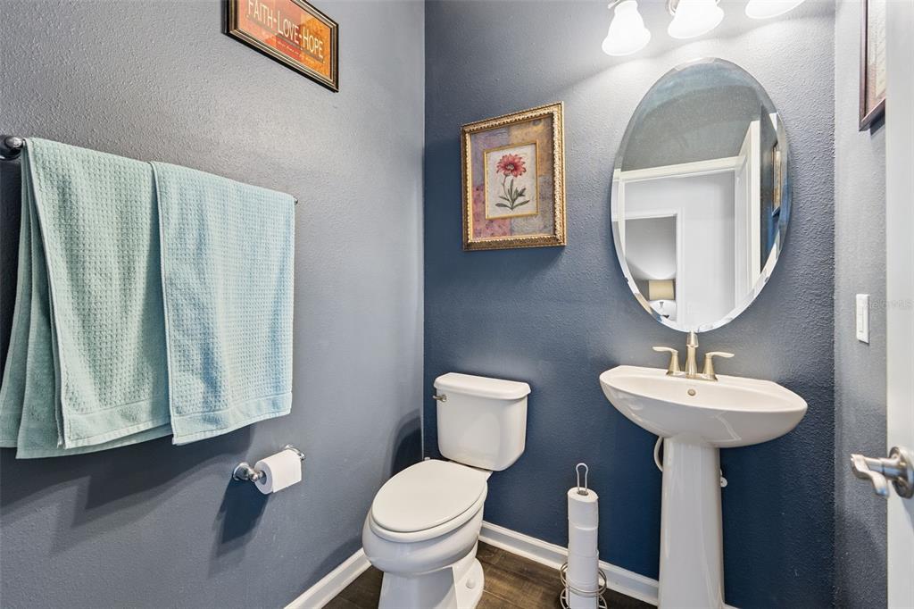 5714 Colony Glen Road Lithia, FL 33547 - Photo 23 of 66 a bathroom with a toilet sink and mirror