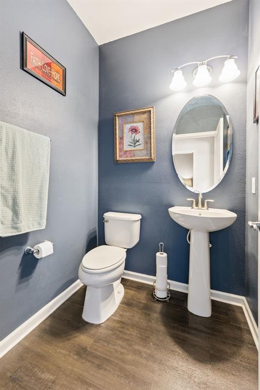 5714 Colony Glen Road Lithia, FL 33547 - Photo 24 of 66 a bathroom with a toilet a sink and mirror