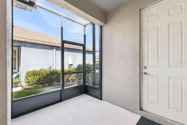 a view of swimming pool with outdoor seating and plants