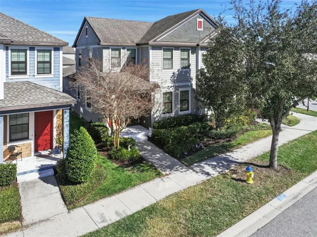 an aerial view of residential houses with outdoor space