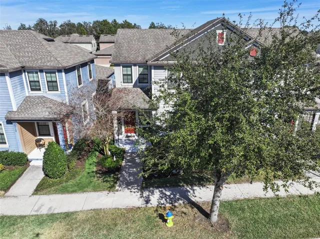 an aerial view of residential building and lake
