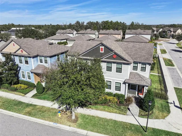 an aerial view of residential houses with outdoor space
