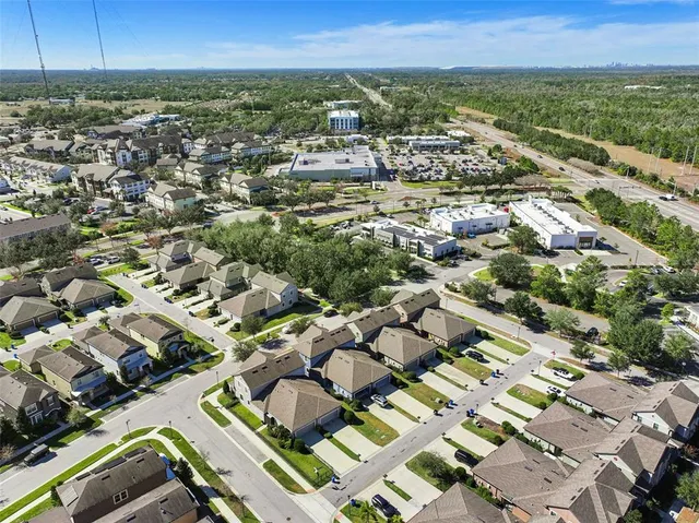 a living room with lots of furniture and a chandelier
