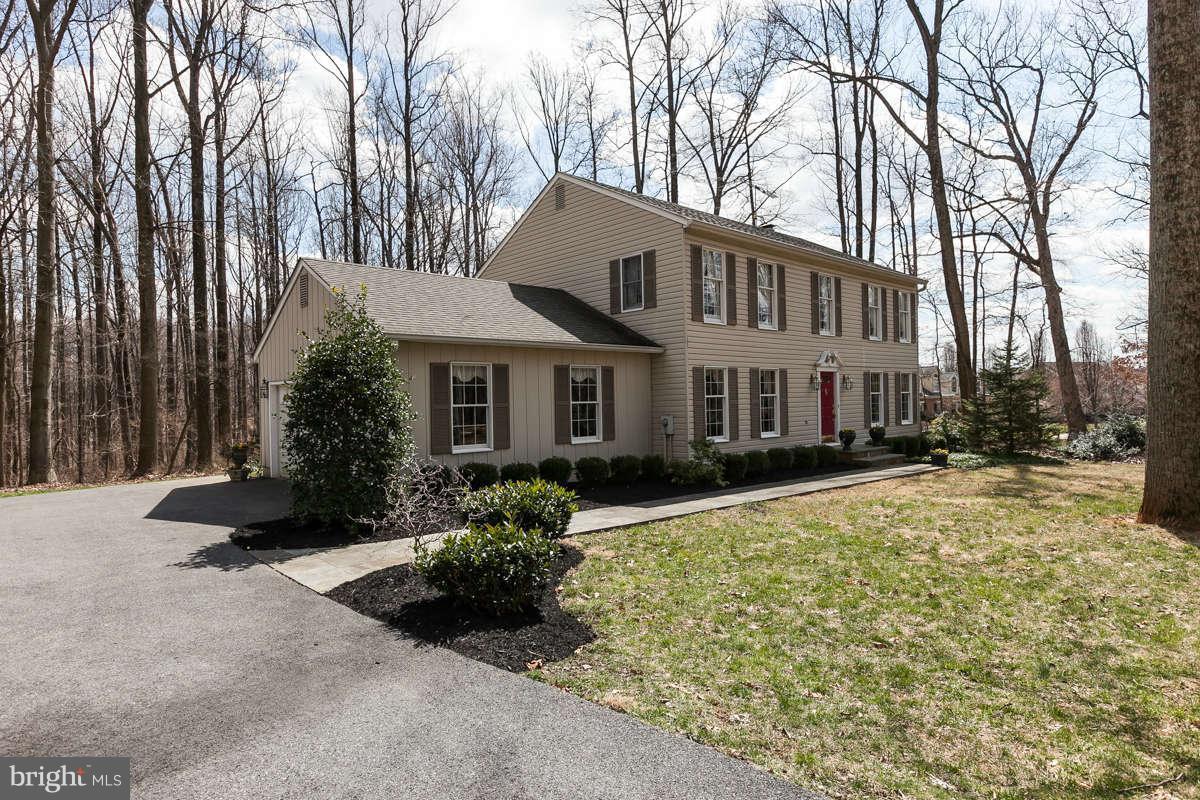 2007 Pine Pep Road Reisterstown, MD 21136 - Photo 2 of 30 a front view of a house with a yard and garage