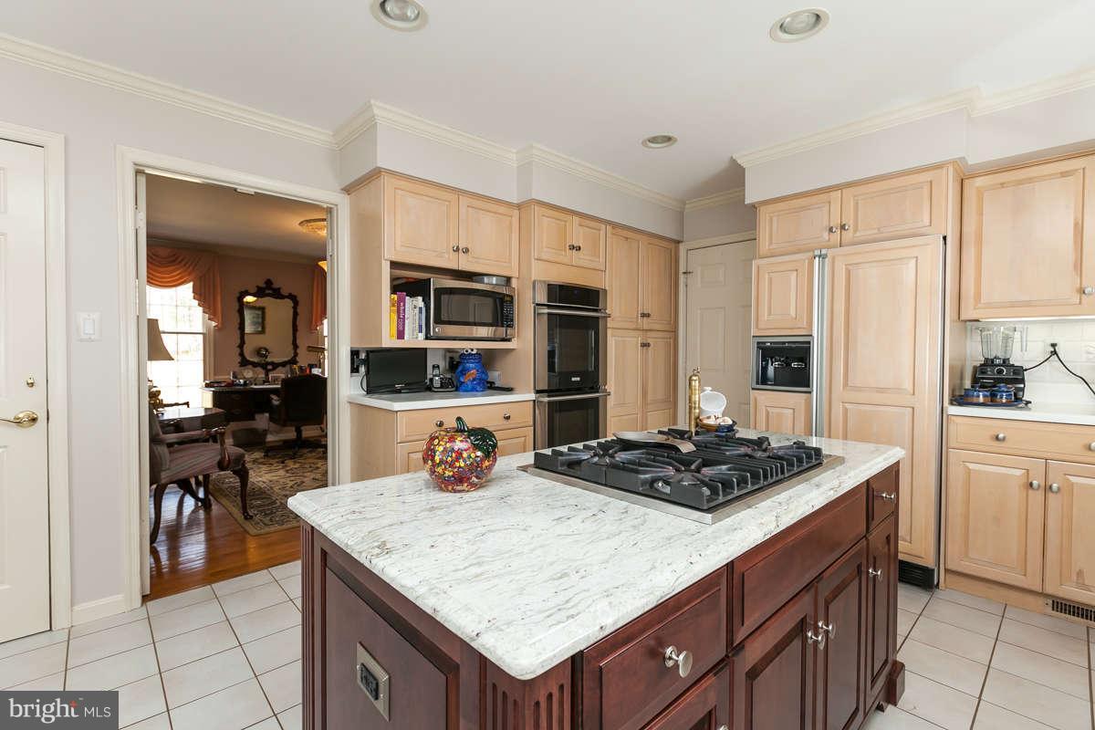 2007 Pine Pep Road Reisterstown, MD 21136 - Photo 12 of 30 a kitchen with a stove a sink a refrigerator and cabinets