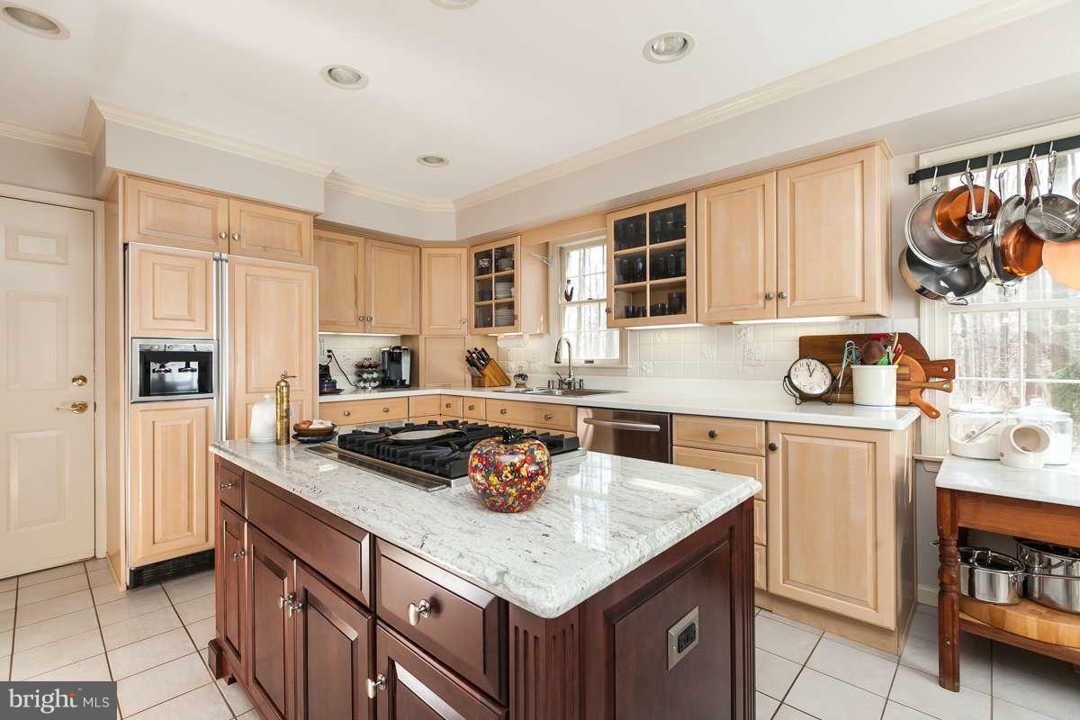 2007 Pine Pep Road Reisterstown, MD 21136 - Photo 13 of 30 a kitchen with stainless steel appliances granite countertop a sink and cabinets