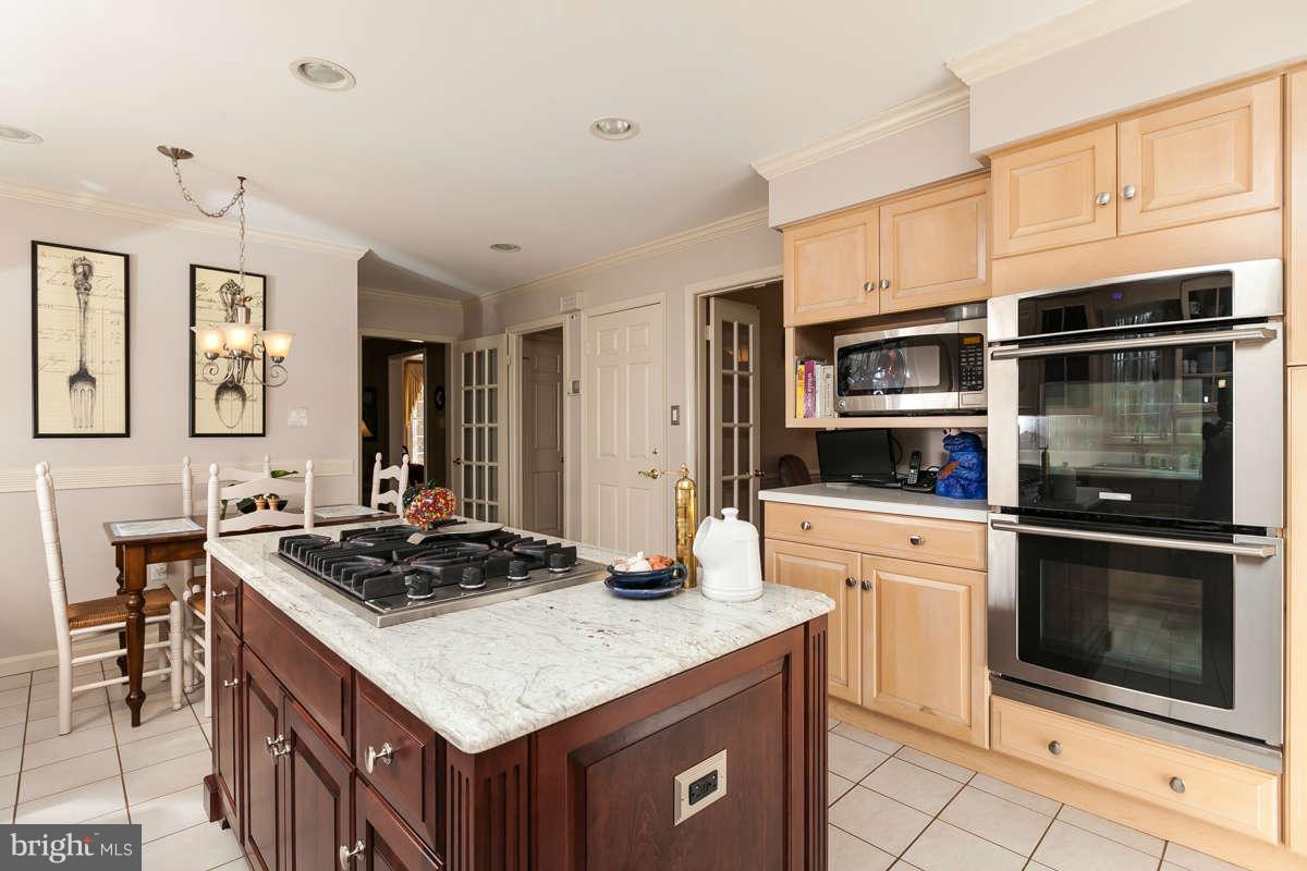 2007 Pine Pep Road Reisterstown, MD 21136 - Photo 14 of 30 a kitchen with stainless steel appliances granite countertop a stove and a sink