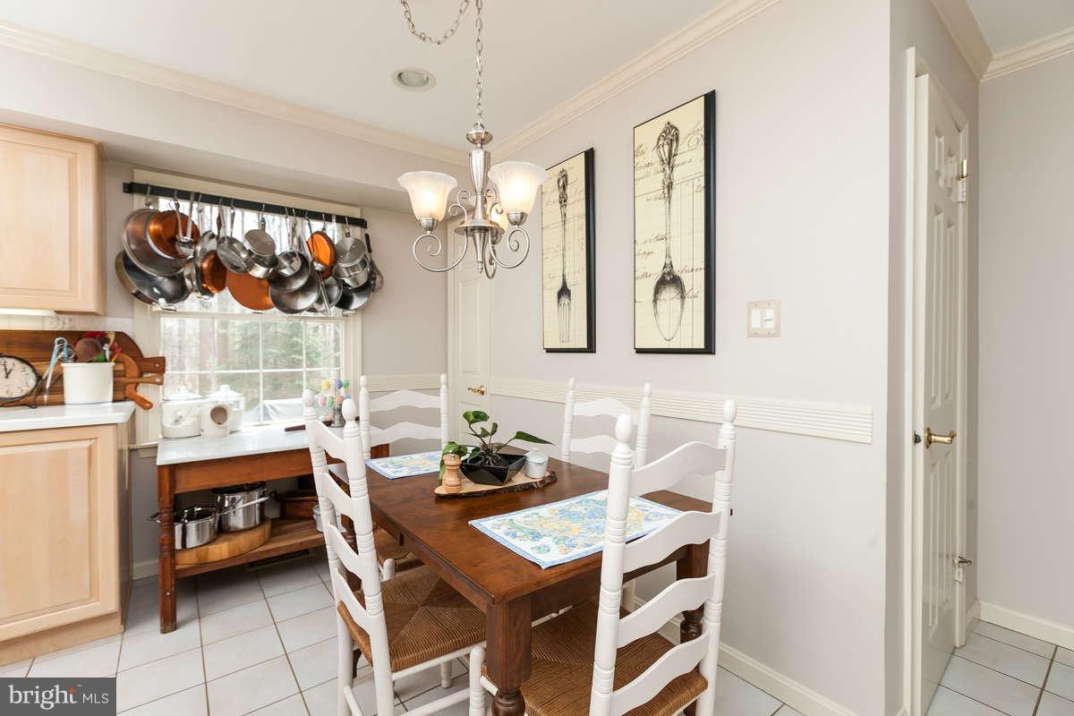 2007 Pine Pep Road Reisterstown, MD 21136 - Photo 15 of 30 a view of a dining room with furniture and chandelier