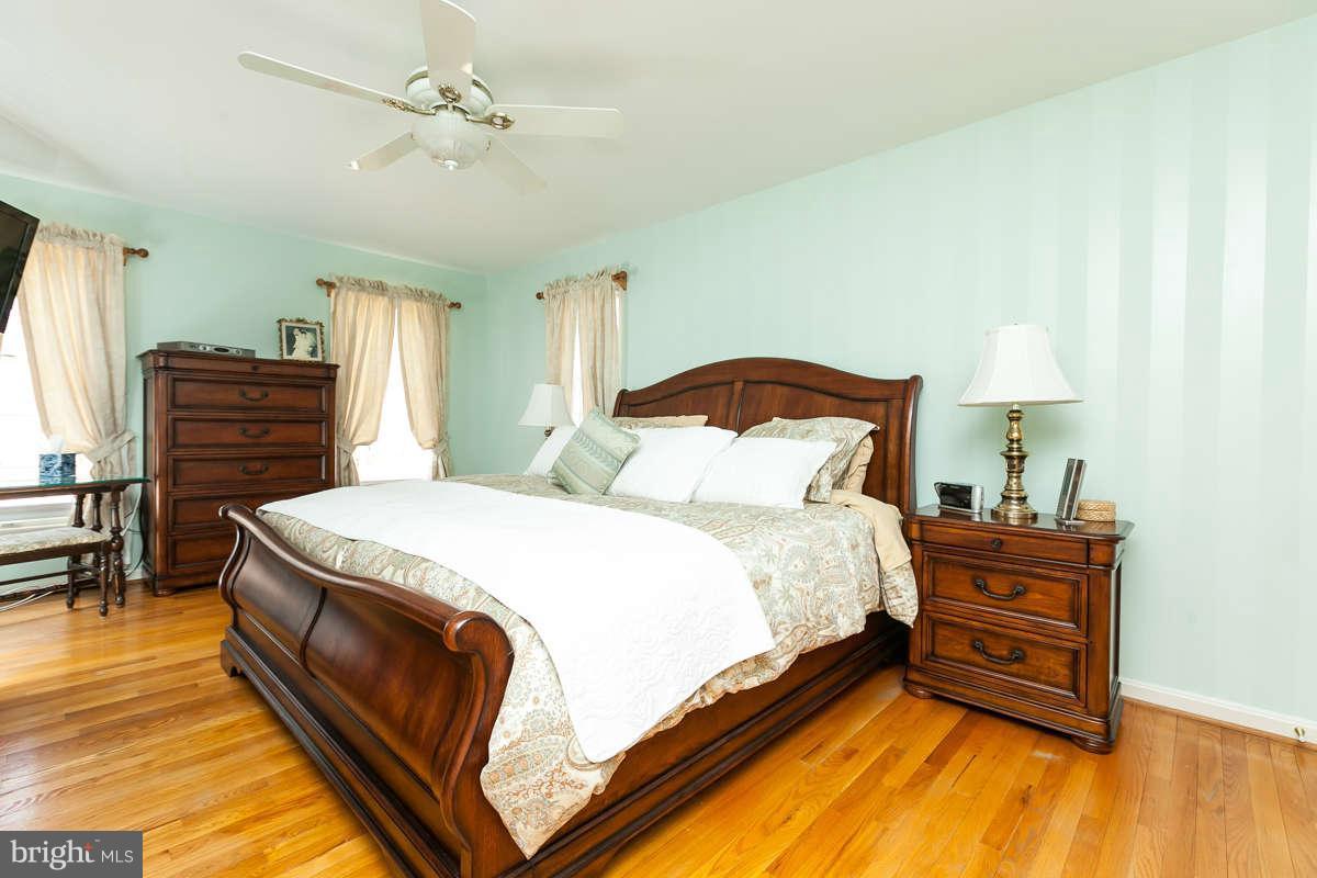 2007 Pine Pep Road Reisterstown, MD 21136 - Photo 20 of 30 a bedroom with a bed and dresser with mirror