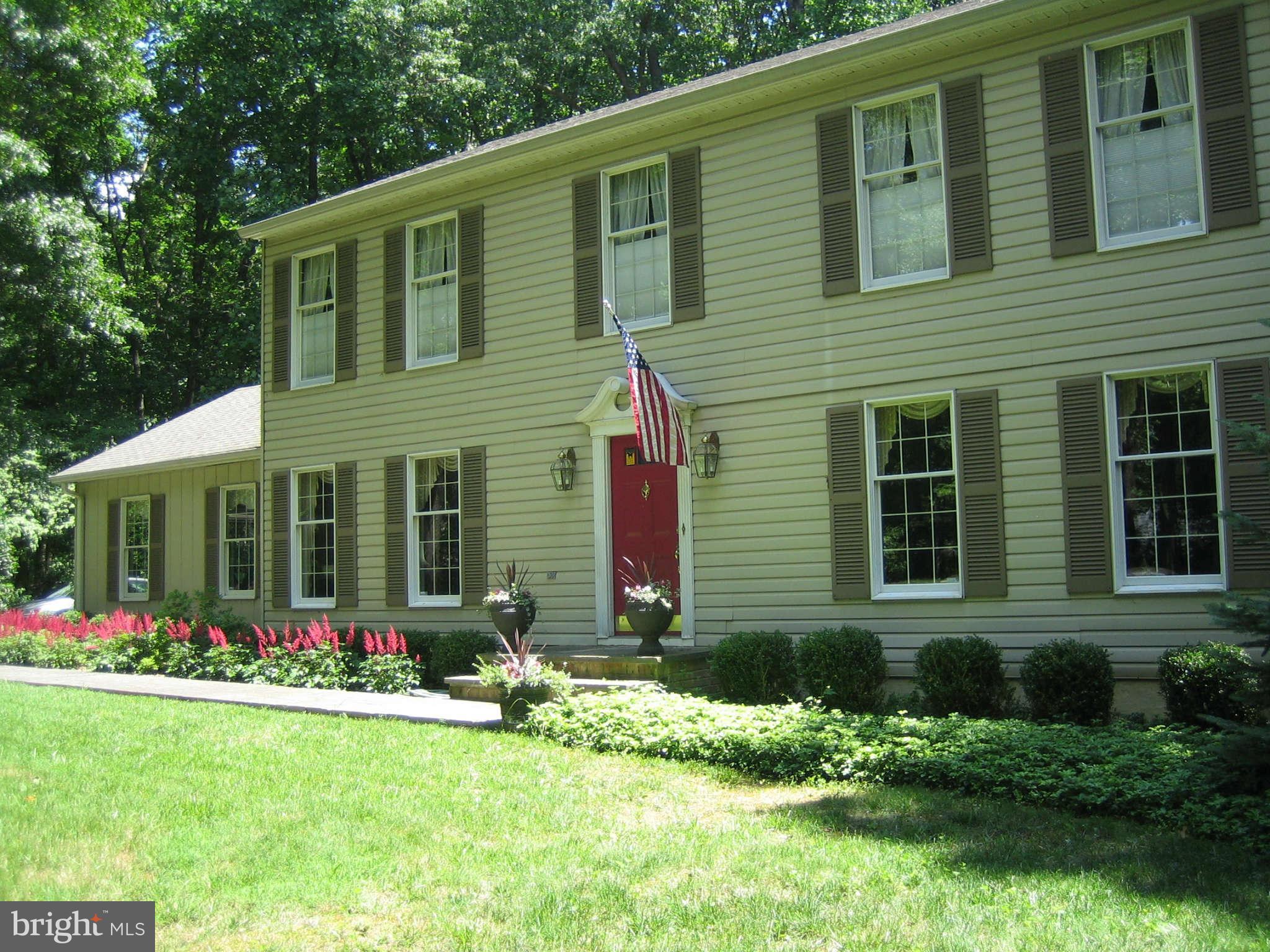 2007 Pine Pep Road Reisterstown, MD 21136 - Photo 3 of 30 a front view of a house with garden