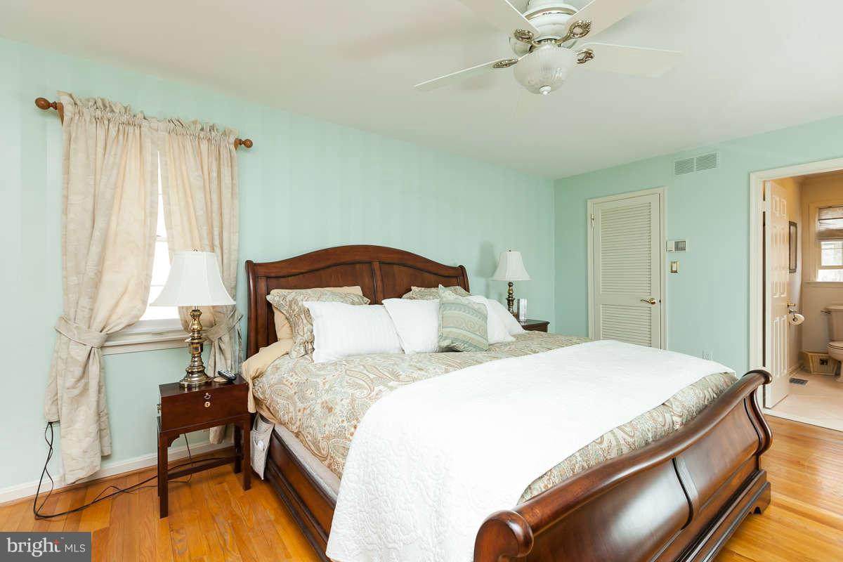 2007 Pine Pep Road Reisterstown, MD 21136 - Photo 21 of 30 a bedroom with a bed and a chandelier