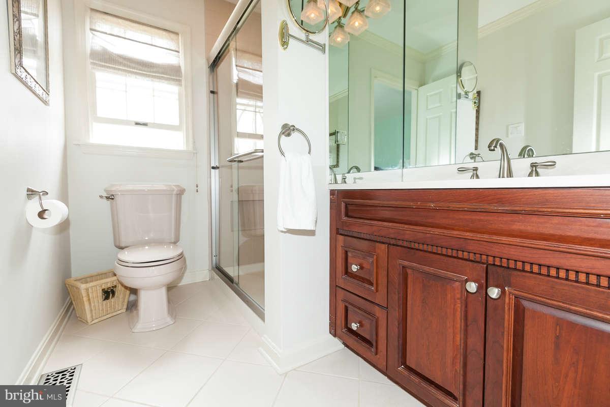 2007 Pine Pep Road Reisterstown, MD 21136 - Photo 22 of 30 a bathroom with a toilet a sink and a mirror