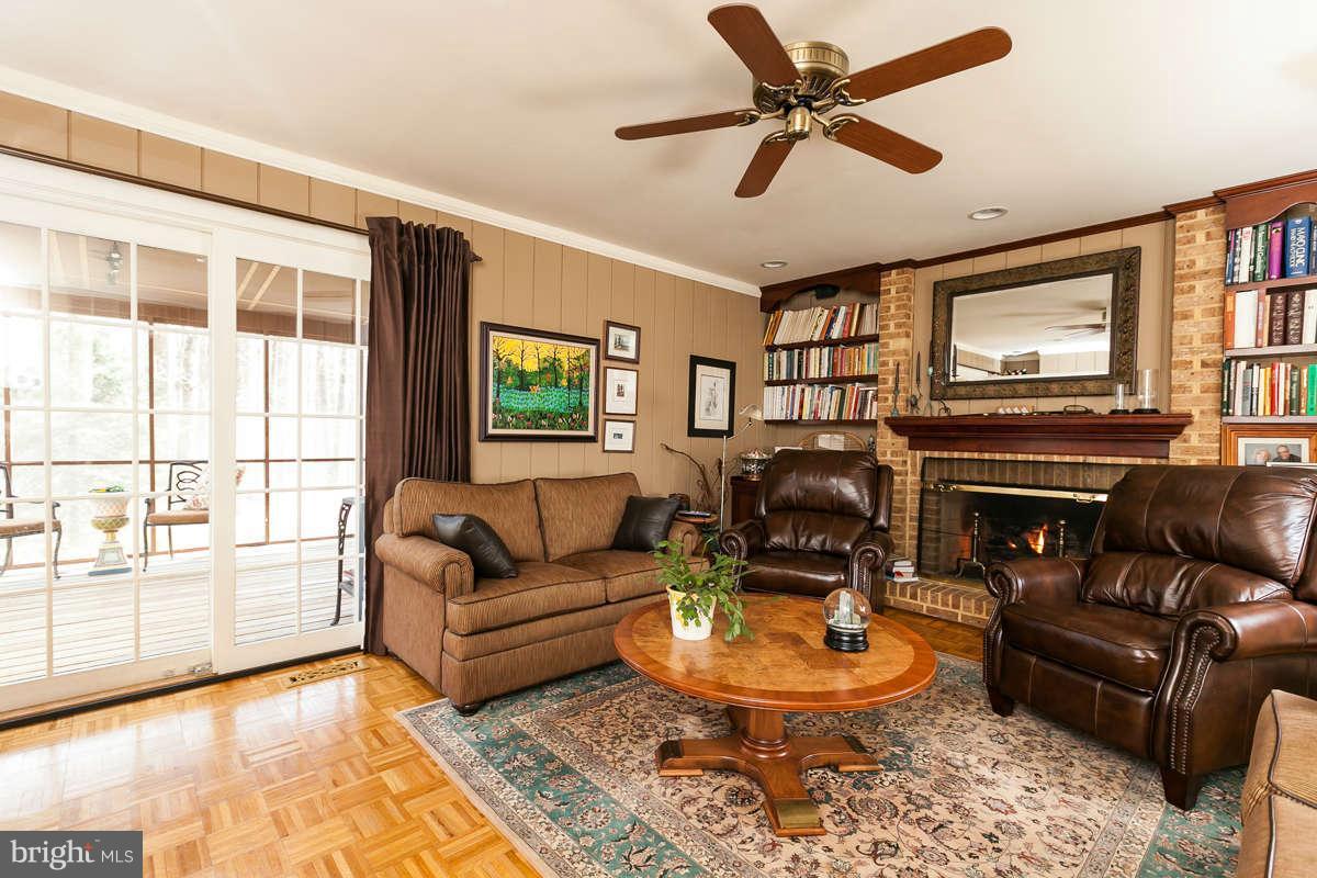 2007 Pine Pep Road Reisterstown, MD 21136 - Photo 10 of 30 a living room with furniture a fireplace and a large window