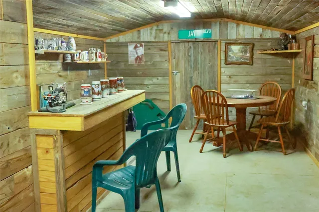 a view of a chairs and table in the patio