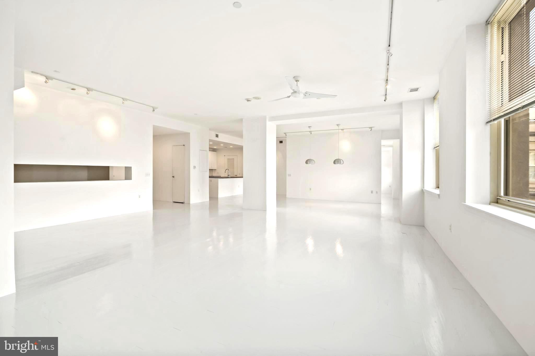 1600 Arch Street, Unit 1809 Philadelphia, PA 19103 - Photo 15 of 36 a view of a hallway with wooden floor