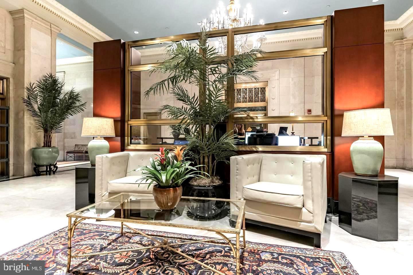 1600 Arch Street, Unit 1809 Philadelphia, PA 19103 - Photo 27 of 36 a living room with furniture and a potted plant