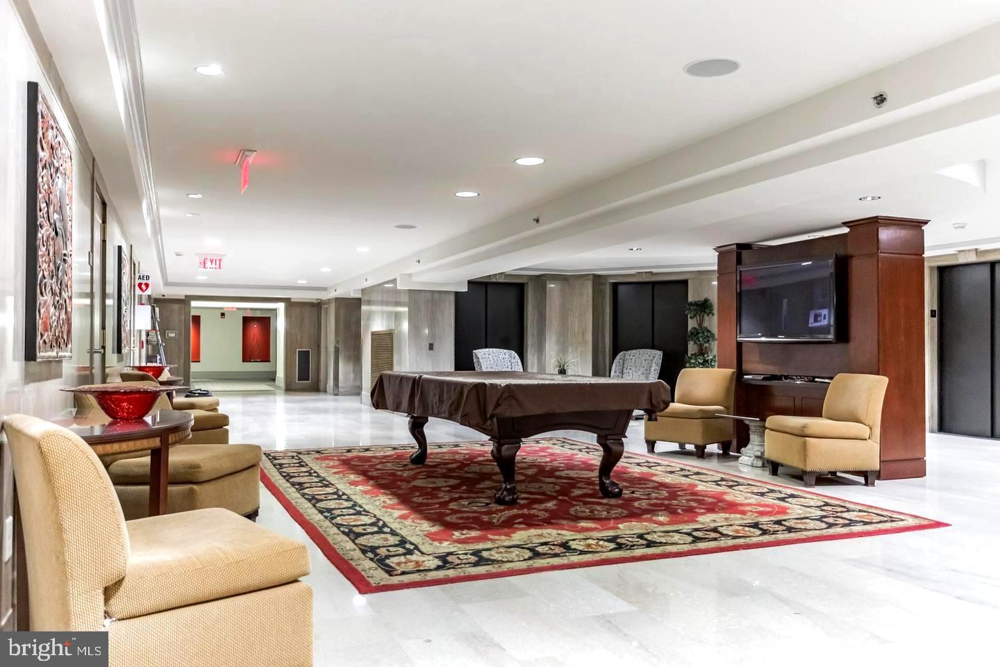 1600 Arch Street, Unit 1809 Philadelphia, PA 19103 - Photo 31 of 36 a living room with furniture and a rug