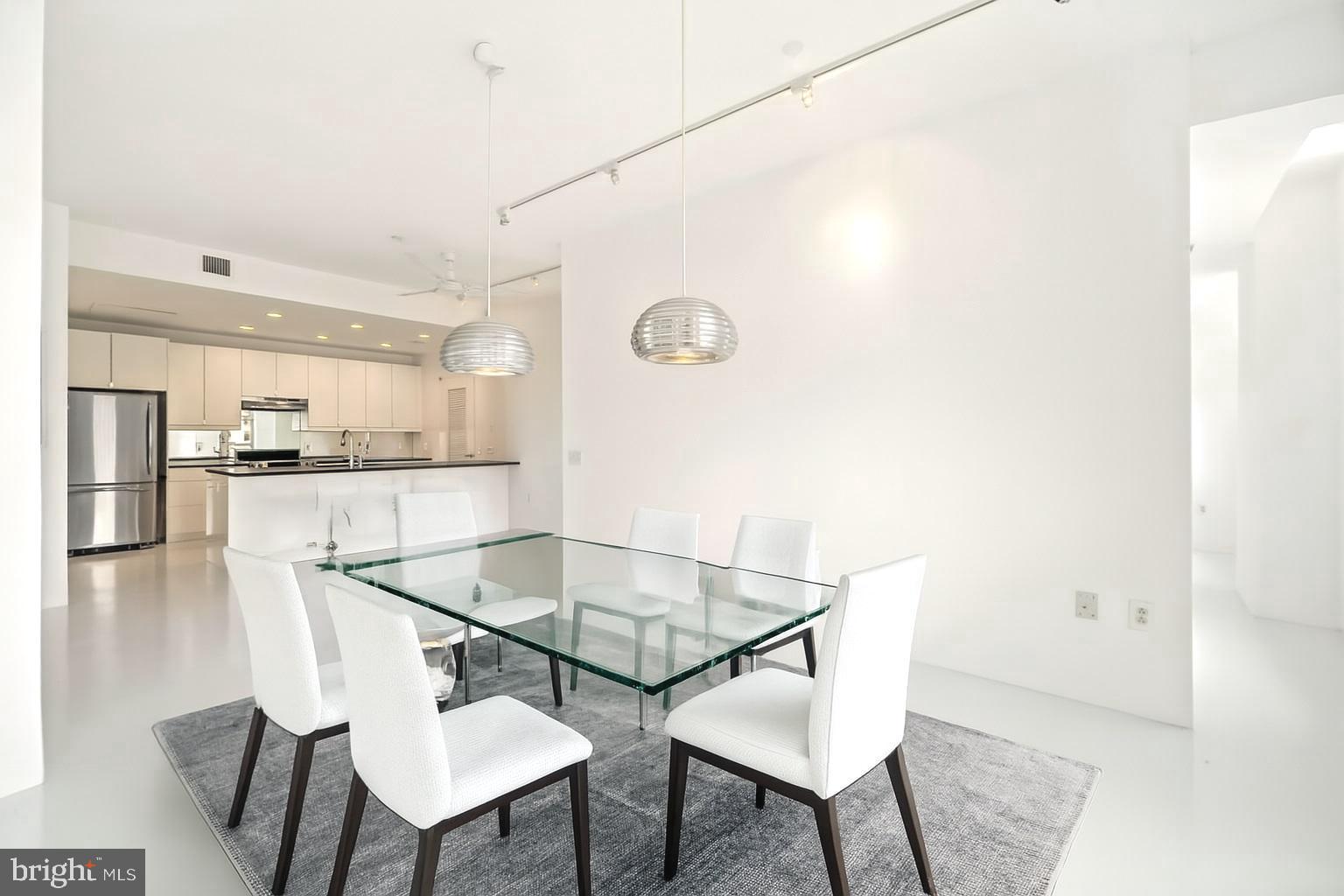 1600 Arch Street, Unit 1809 Philadelphia, PA 19103 - Photo 5 of 36 a dining room with furniture and wooden floor