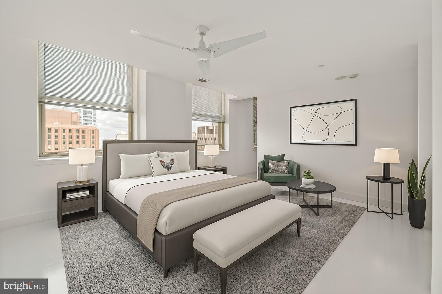 1600 Arch Street, Unit 1809 Philadelphia, PA 19103 - Photo 7 of 36 a bedroom with a bed painting on wall and windows