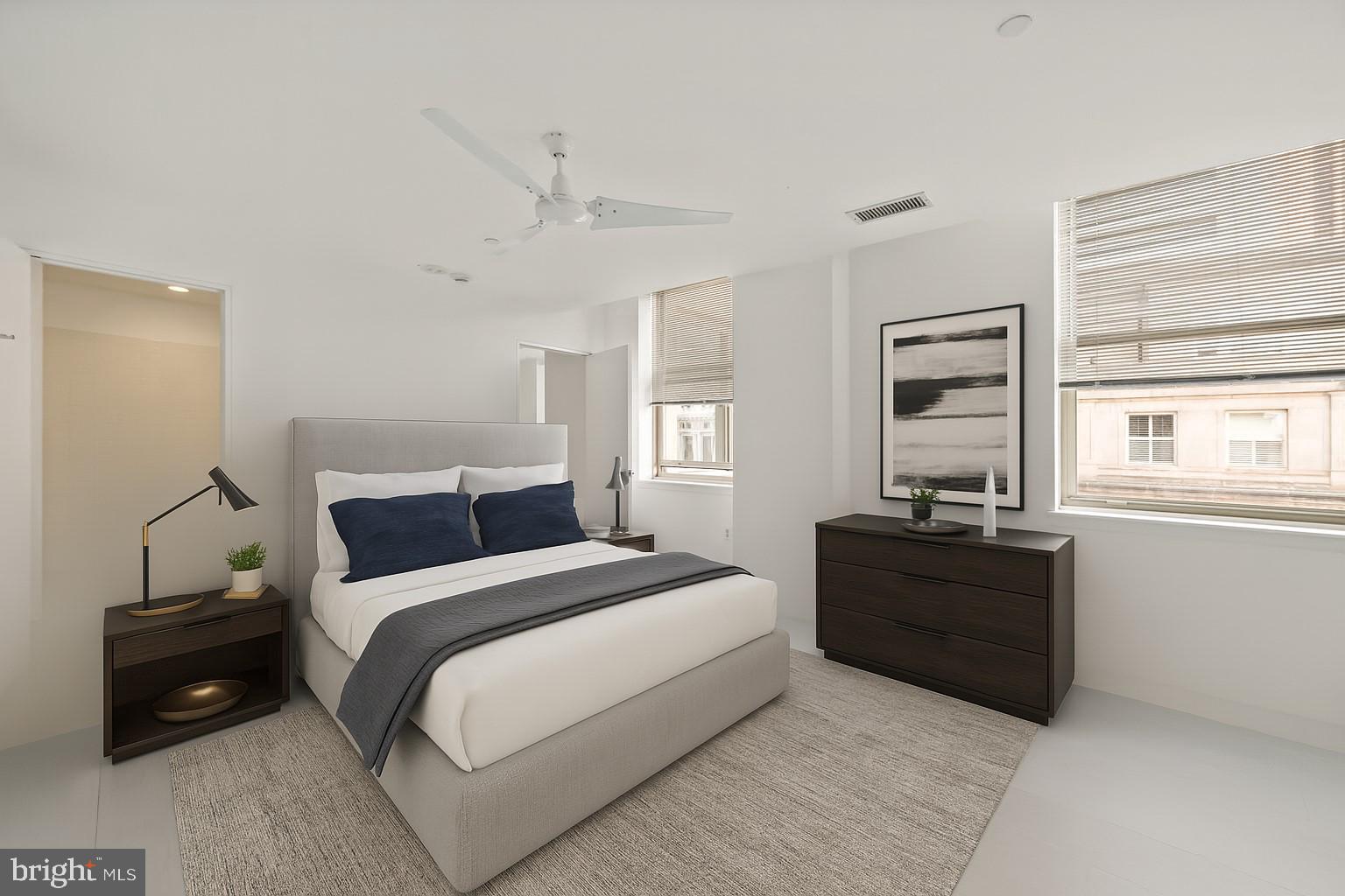 1600 Arch Street, Unit 1809 Philadelphia, PA 19103 - Photo 9 of 36 a bedroom with a bed and a window