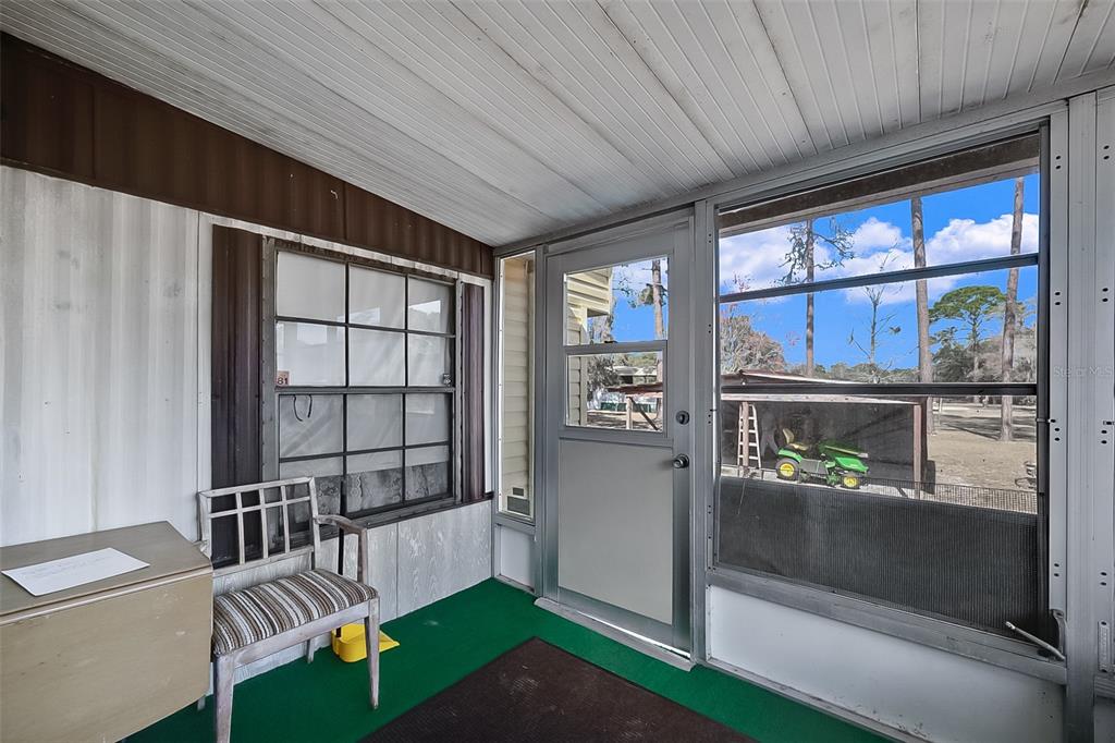 123 Miller Road Pomona Park, FL 32181 - Photo 12 of 36 a view of a hallway with furniture and front door