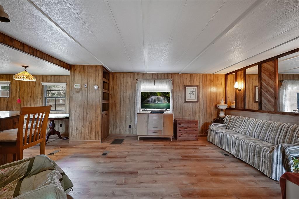 123 Miller Road Pomona Park, FL 32181 - Photo 15 of 36 a bedroom with furniture and a window