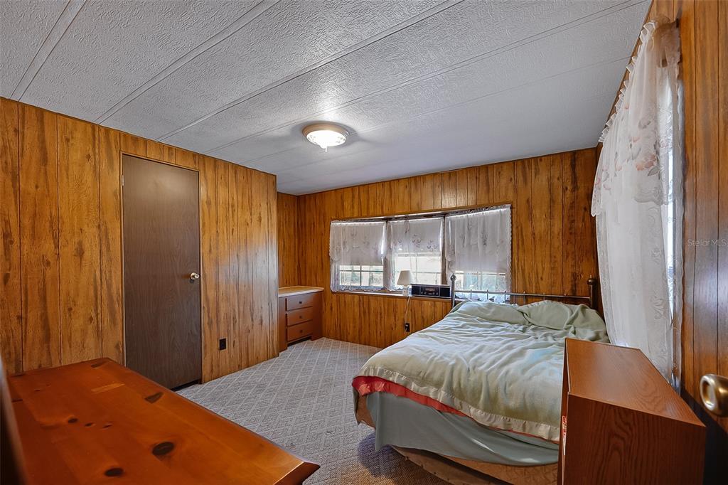 123 Miller Road Pomona Park, FL 32181 - Photo 18 of 36 a bedroom with a bed and a window