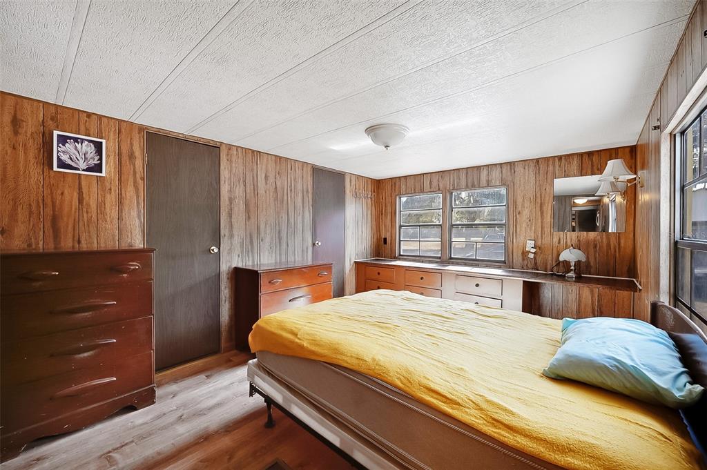 123 Miller Road Pomona Park, FL 32181 - Photo 24 of 36 a bedroom with a large bed and a dresser