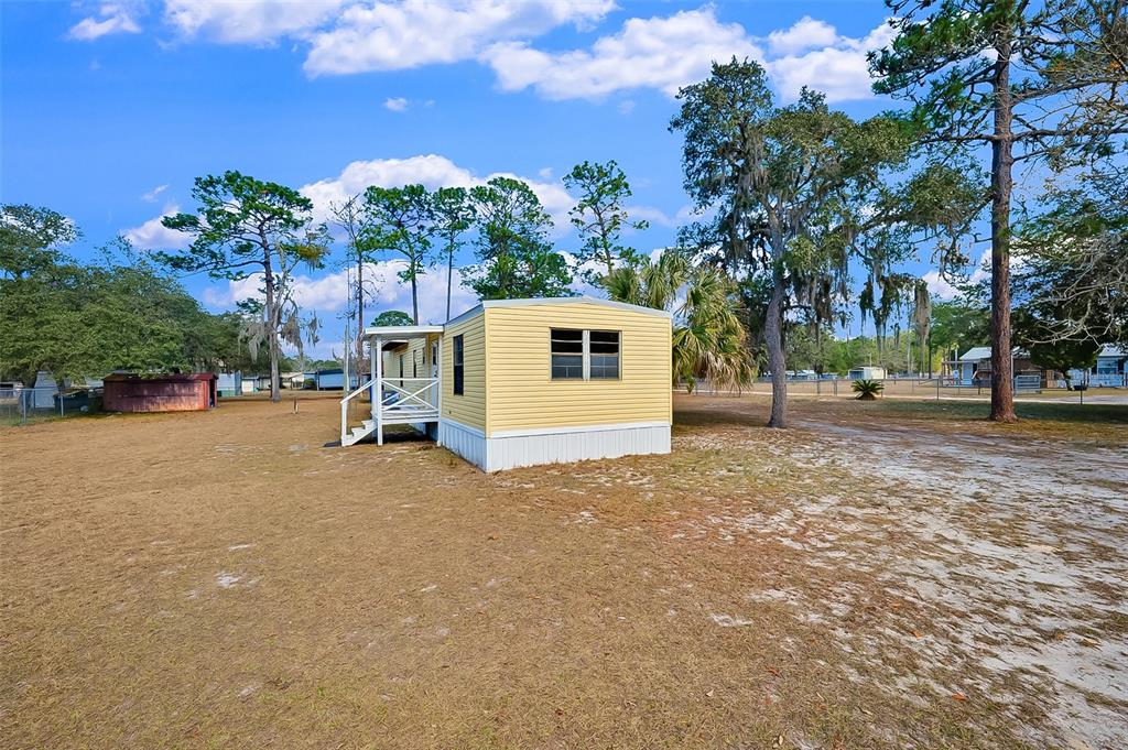 123 Miller Road Pomona Park, FL 32181 - Photo 28 of 36 a view of a house with a yard and garage