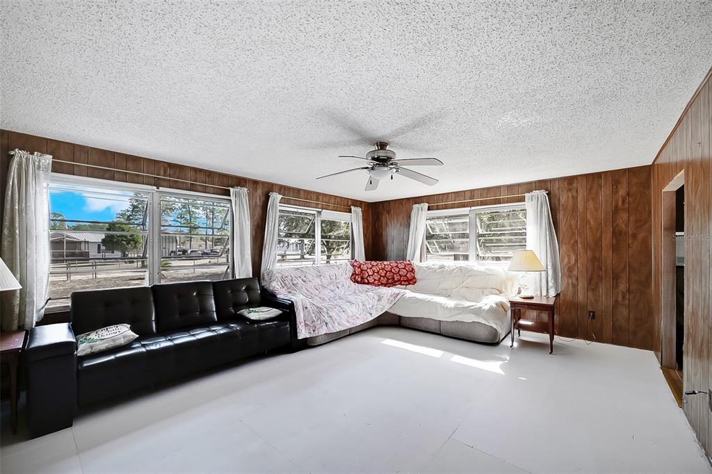 123 Miller Road Pomona Park, FL 32181 - Photo 3 of 36 a living room with furniture and a large window