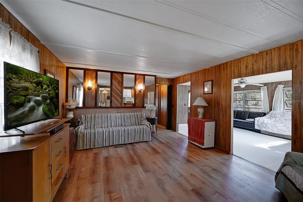 123 Miller Road Pomona Park, FL 32181 - Photo 4 of 36 a view of a porch with wooden floor and outdoor space