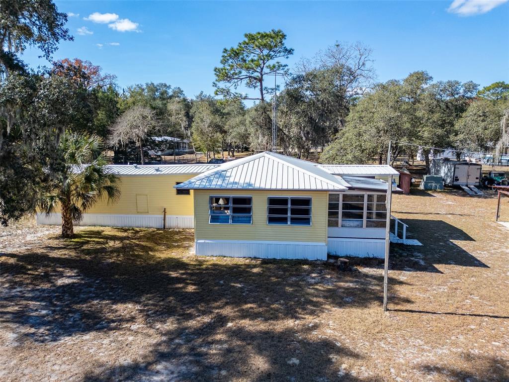 123 Miller Road Pomona Park, FL 32181 - Photo 7 of 36 a front view of a house with a yard