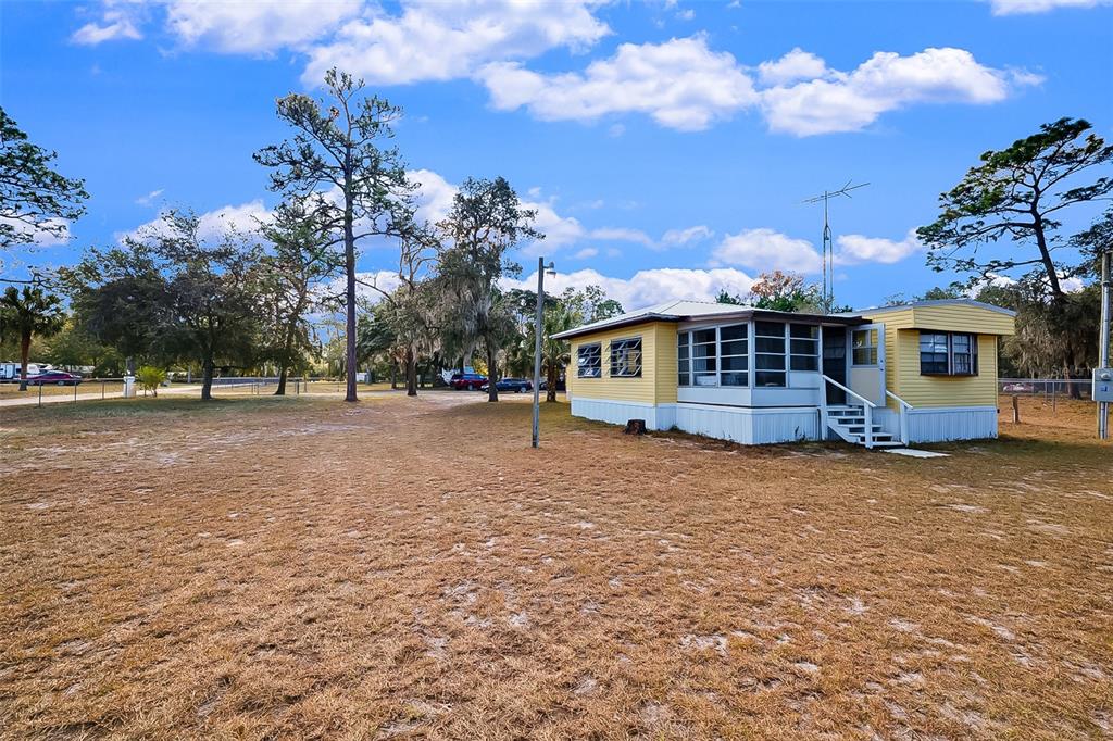 123 Miller Road Pomona Park, FL 32181 - Photo 9 of 36 a front view of a house with a yard