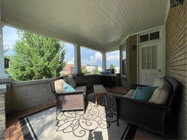 a outdoor living space with furniture and a potted plant