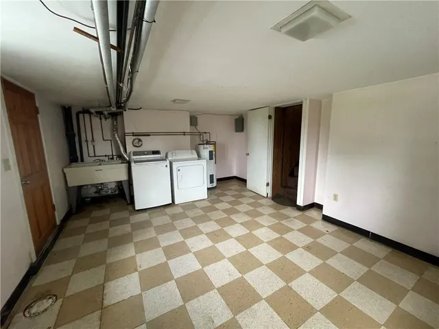 a view of a storage & utility room with a sink
