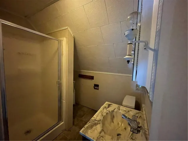 a bathroom with a bathtub and shower
