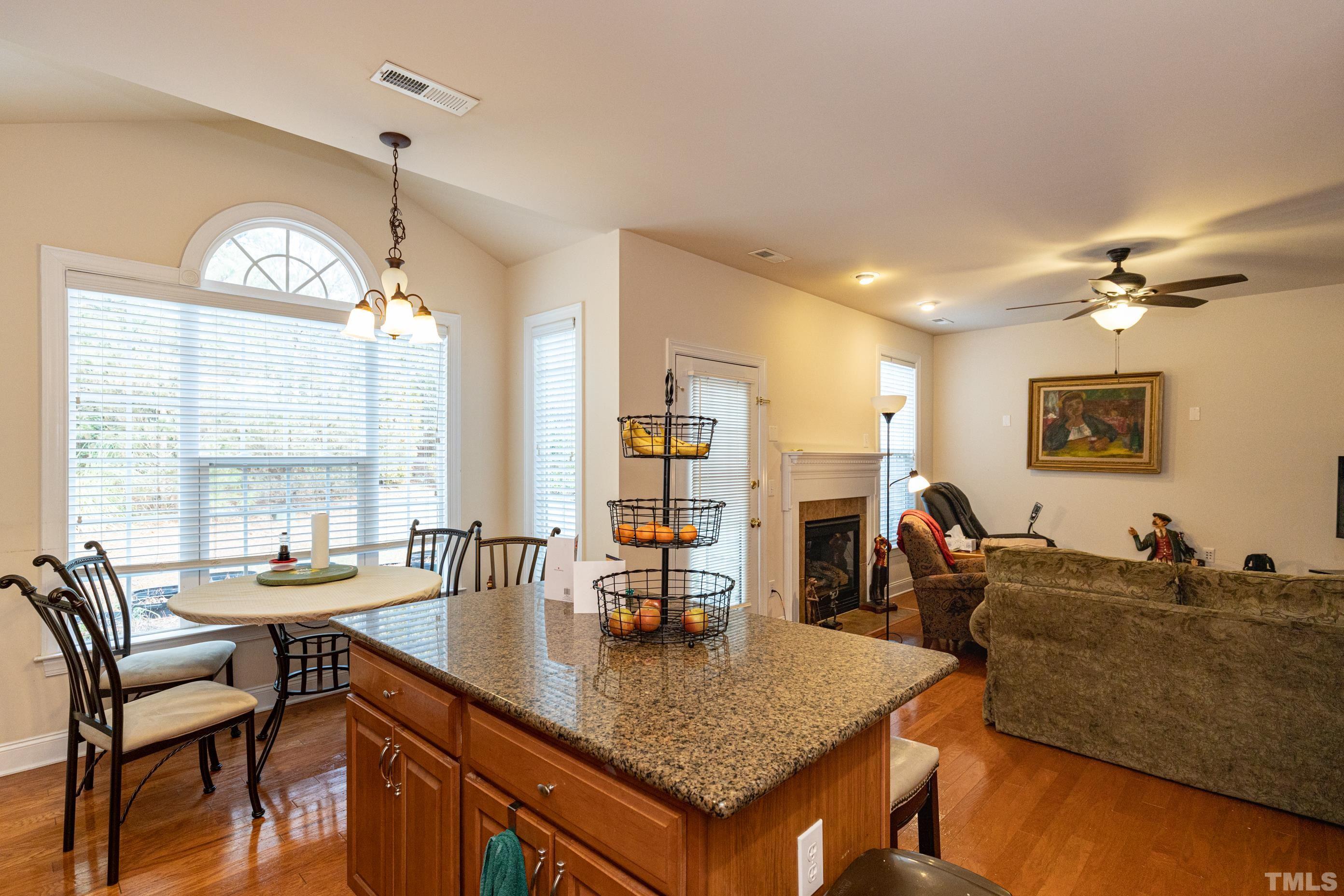 11210 Maplecroft Court Raleigh, NC 27617 - Photo 15 of 30 a living room with furniture a large window and a table