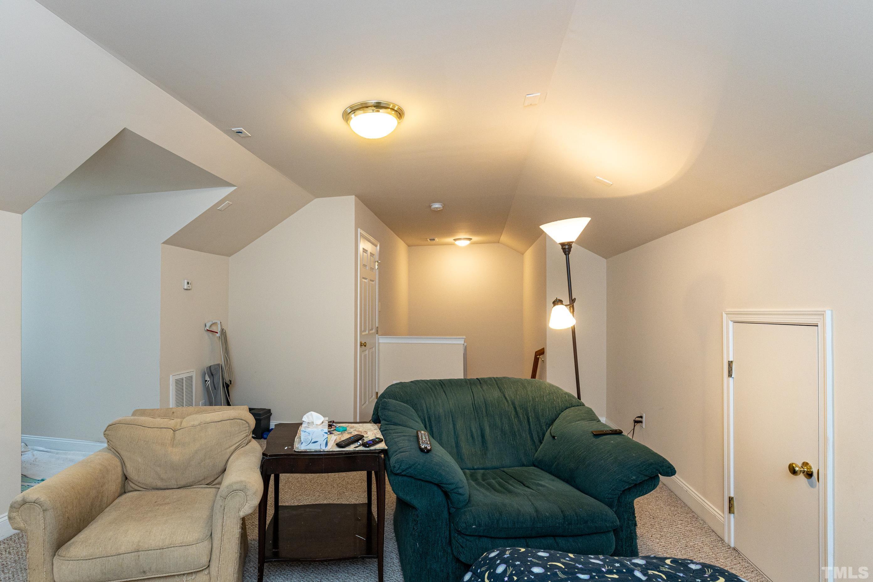 11210 Maplecroft Court Raleigh, NC 27617 - Photo 28 of 30 a living room with furniture and a couch