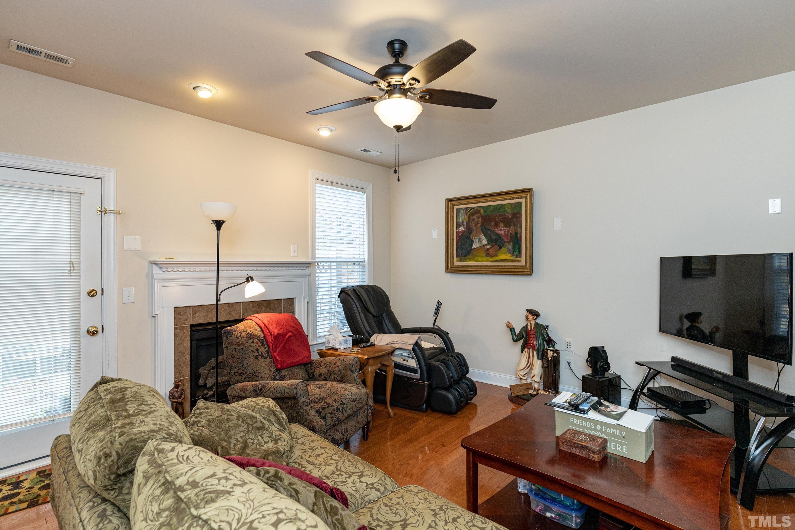 11210 Maplecroft Court Raleigh, NC 27617 - Photo 10 of 30 a living room with furniture and a flat screen tv