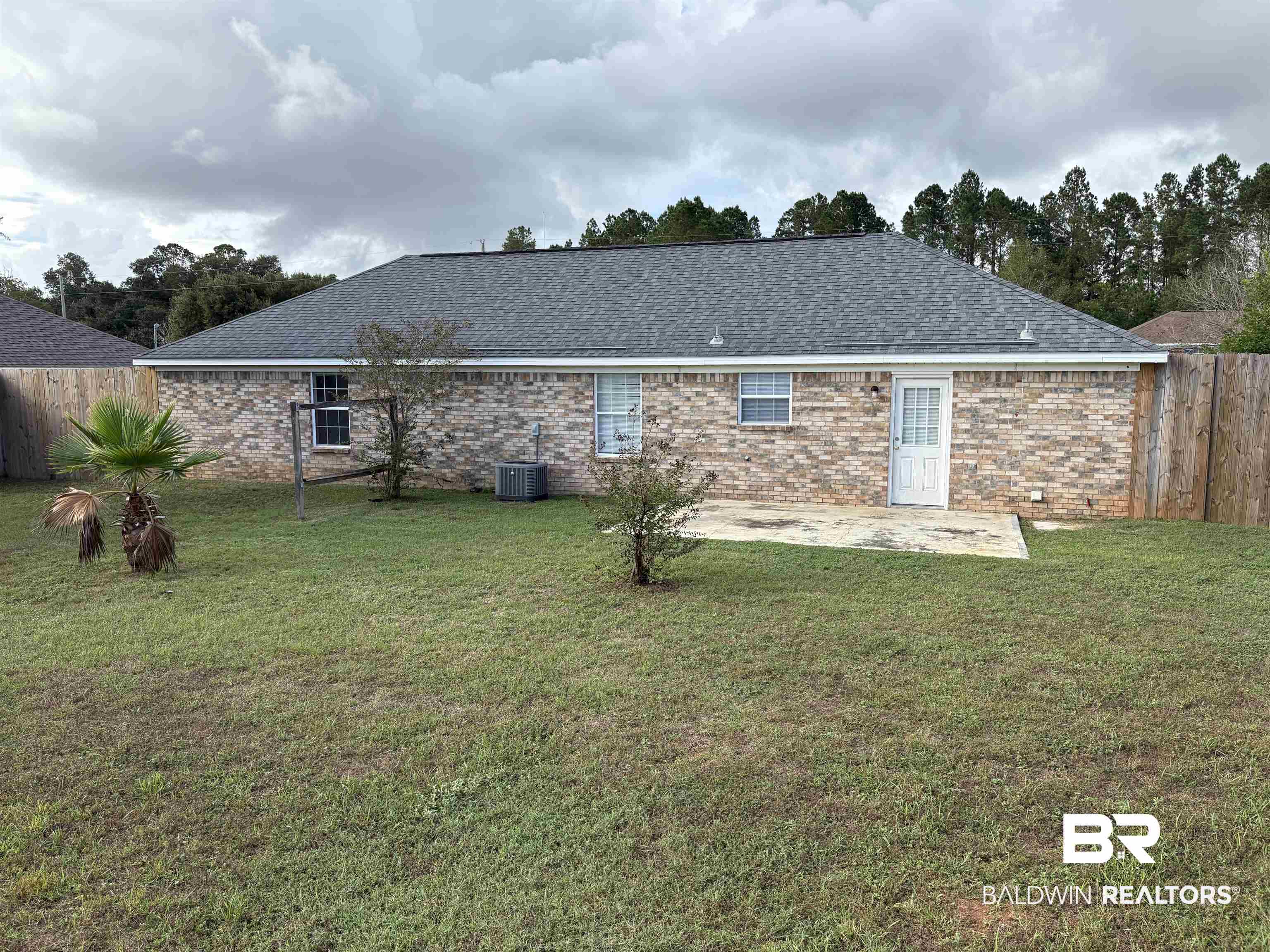 13281 Labradors Run Foley, AL 36535 - Photo 2 of 7 Rear view of property with a patio, brick siding, and a shingled roof