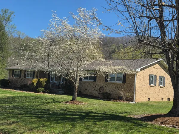 a view of outdoor space with deck and green space