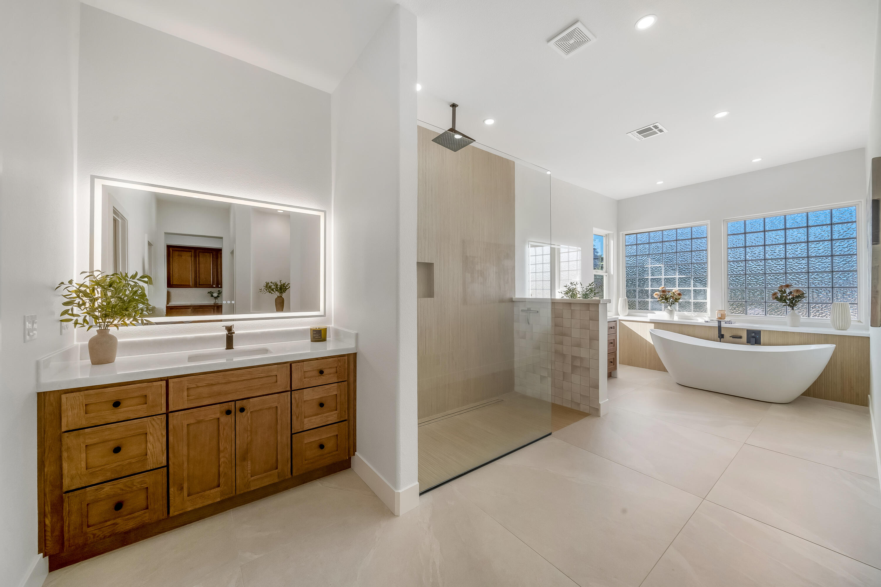 80262 Amazon Avenue Indio, CA 92201 - Photo 50 of 69 a spacious bathroom with a double vanity sink mirror and bathtub