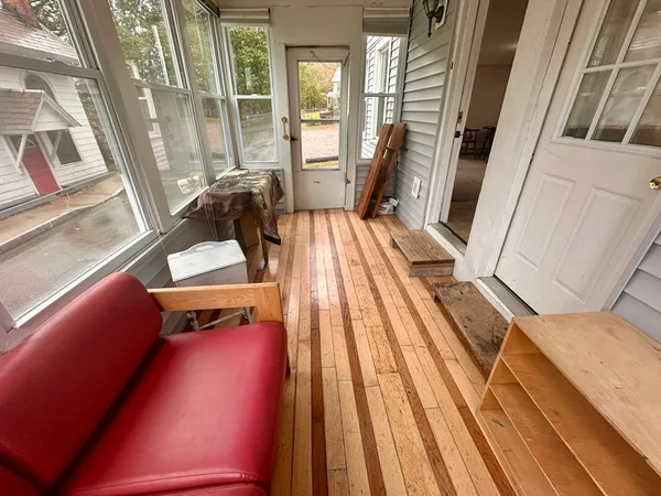 a view of balcony with furniture