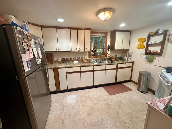 a large kitchen with a large window