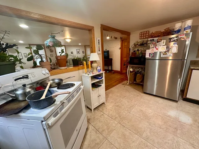 a view of a kitchen with appliances and cabinets